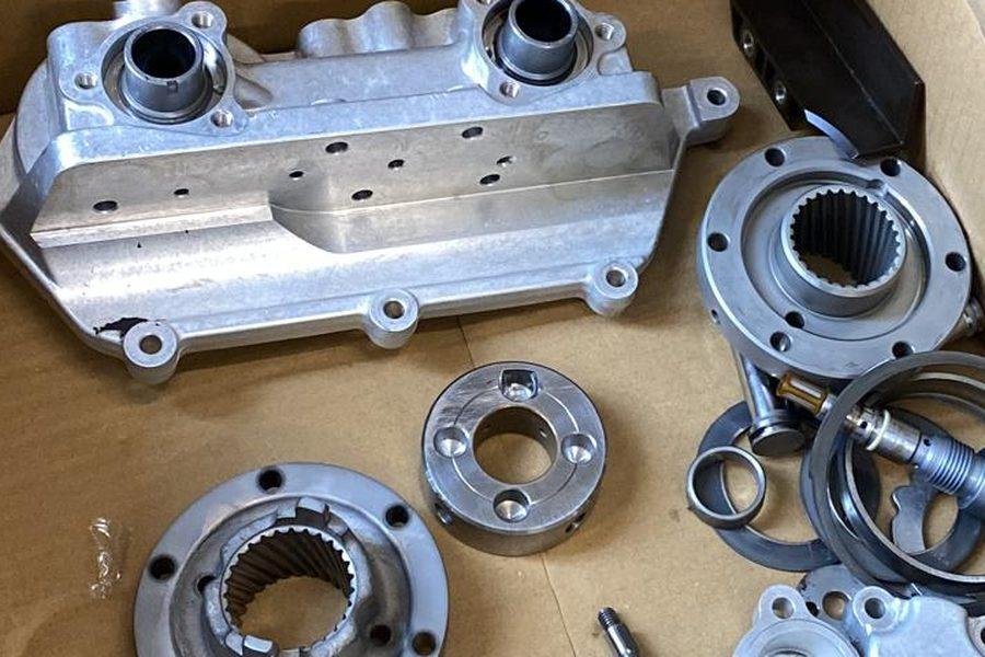 Disassembled VANOS unit — cover, hubs and parts for overhaul